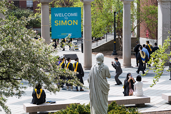 Graduating Students Outside Carol Simon Hall