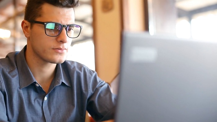 A student works on something on their laptop